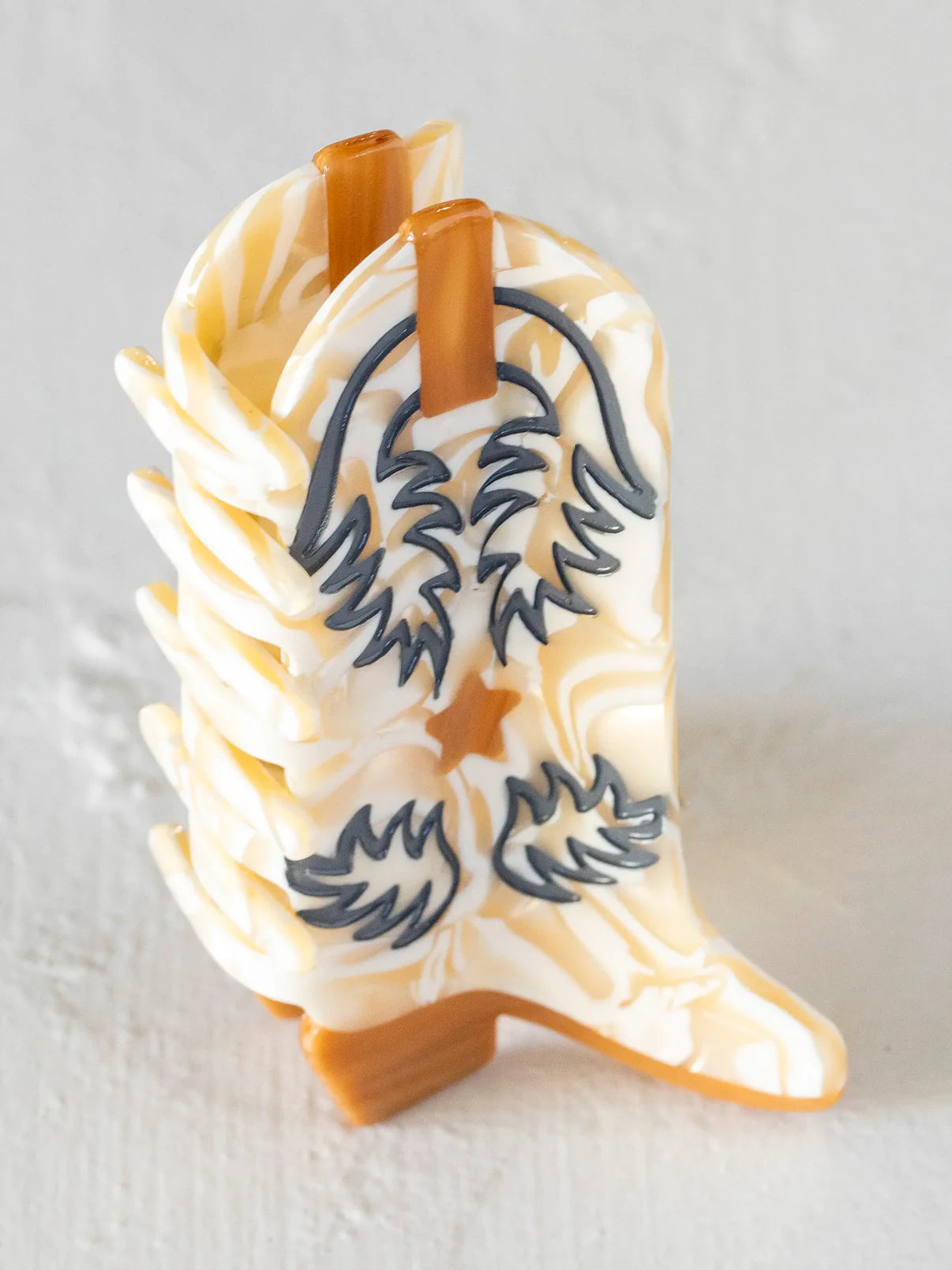 cream boot hair claw