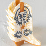 cream boot hair claw