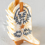 cream boot hair claw