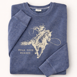 Folded blue sweatshirt with horse graphic and text on a white background