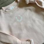 blushing horseshoe sweatshirt